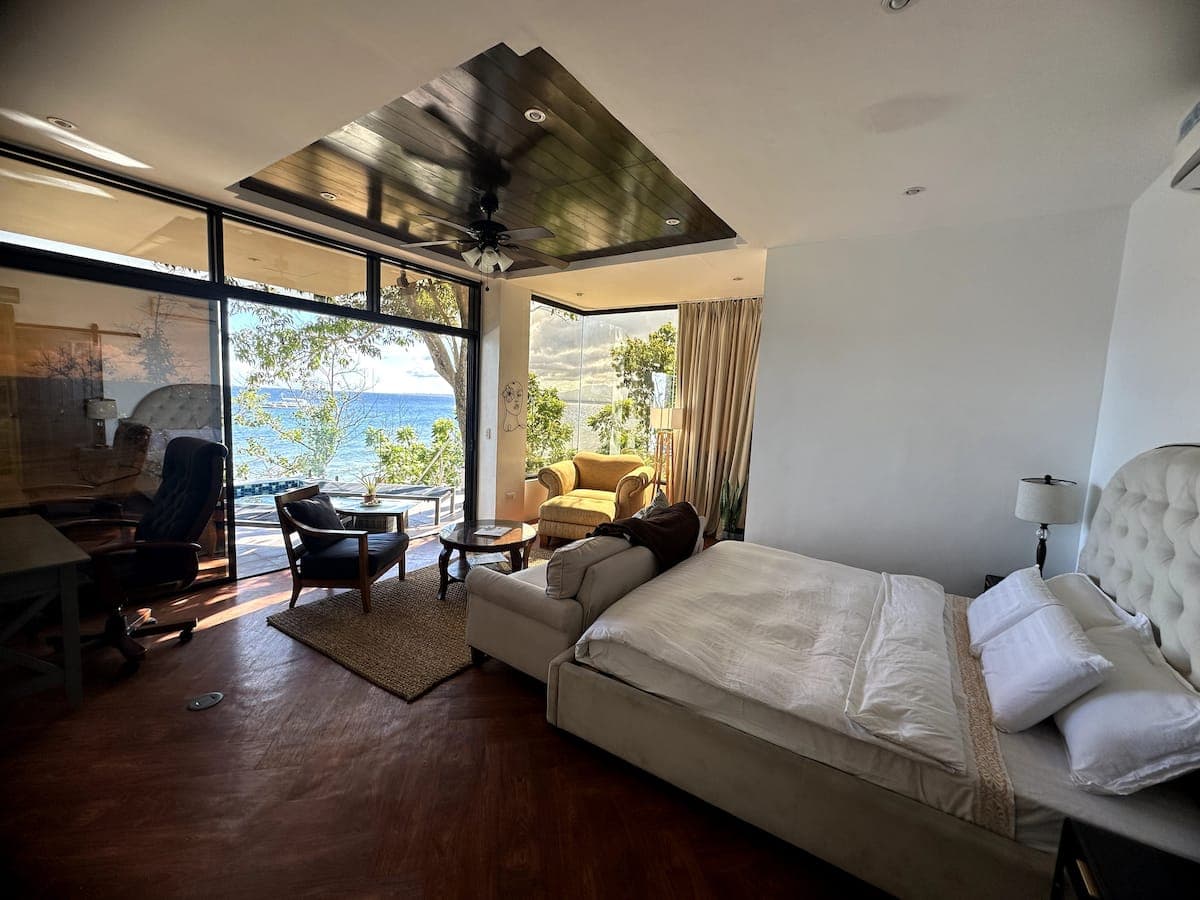 A master bedroom open to a sea view