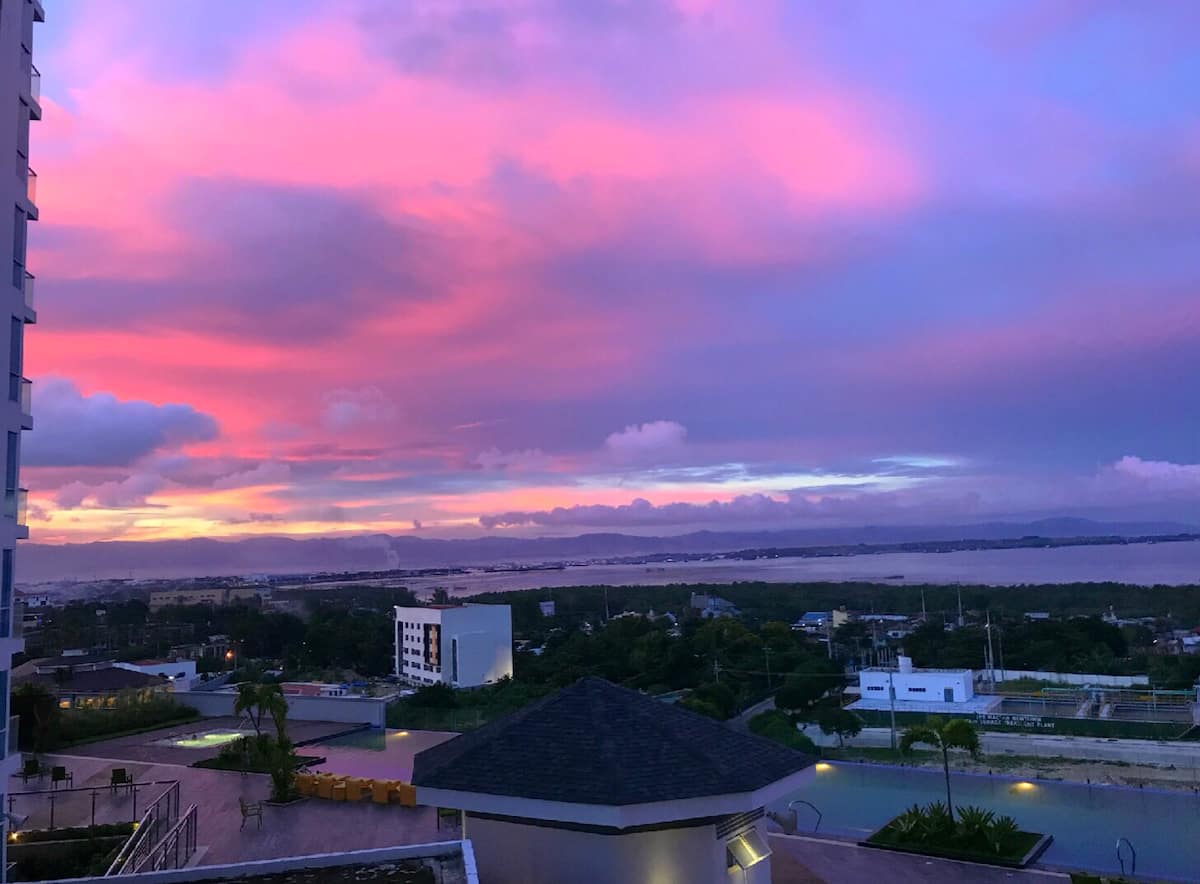 Sunset over the township from a Mactan condo balcony
