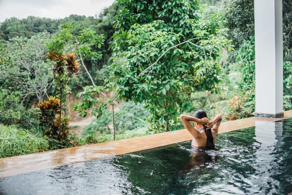 The saltwater infinity lap pool with a Cebu skyline view at The Secret Hut